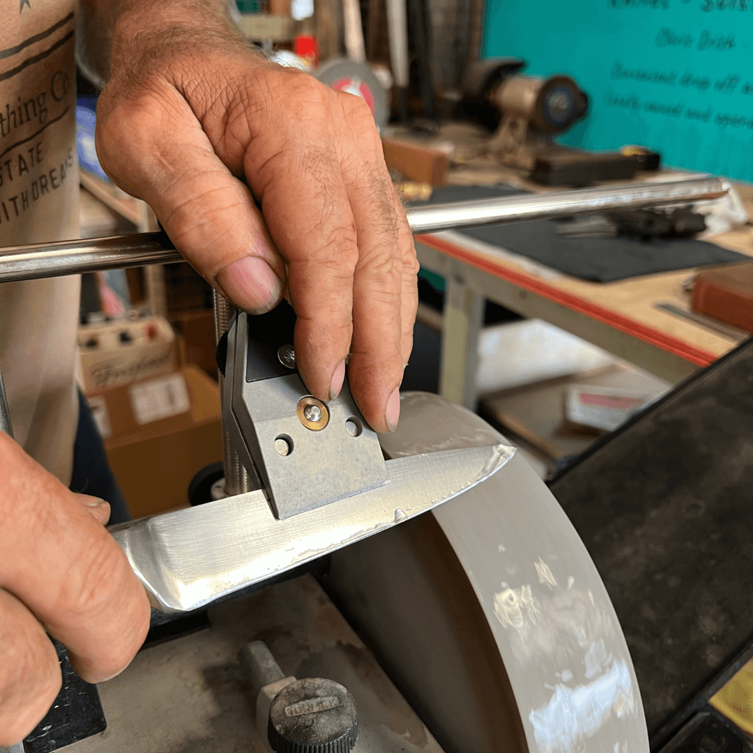 Sharpening a kitchen knife on a whetstone