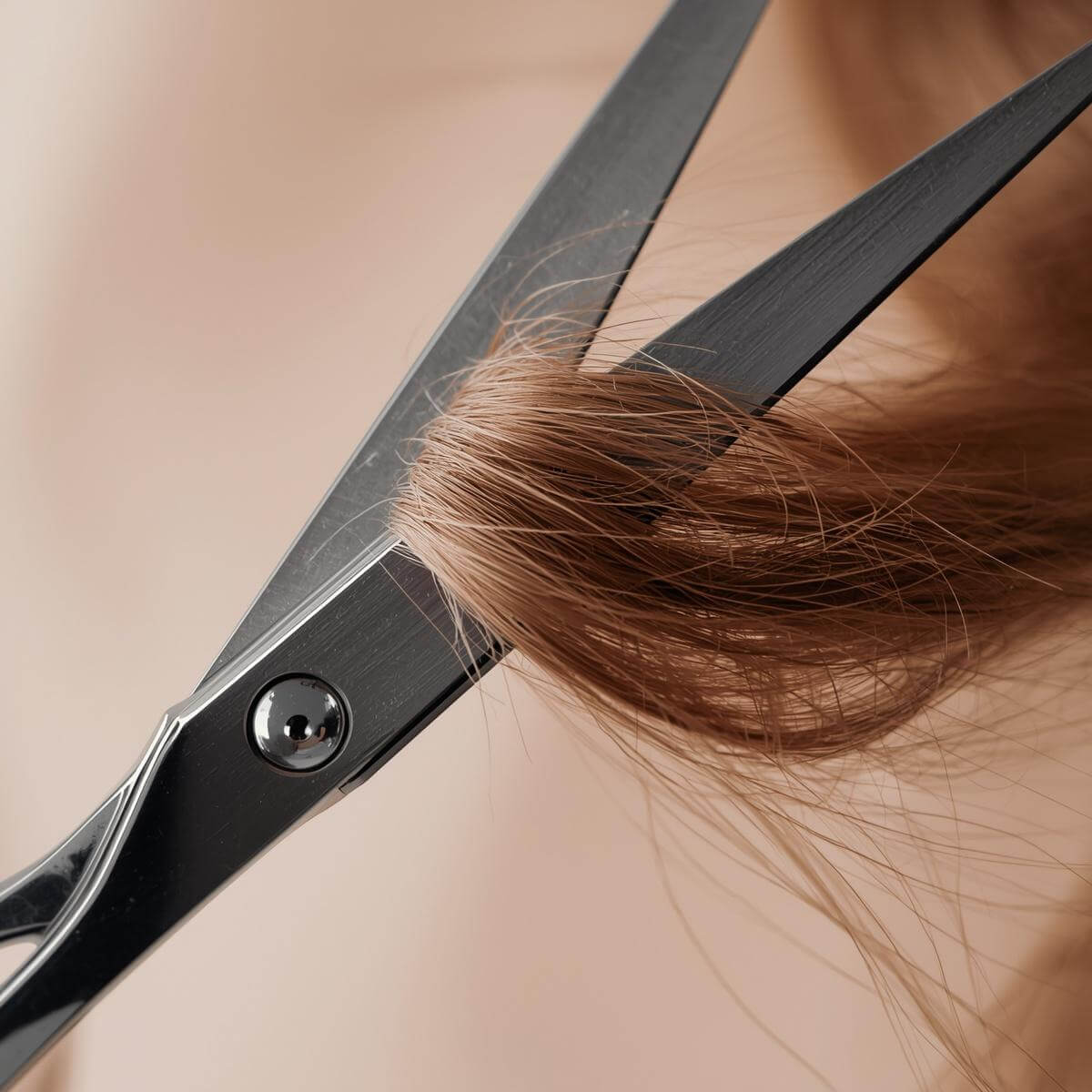 A close up of blunt scissors and tangled uncut hair
