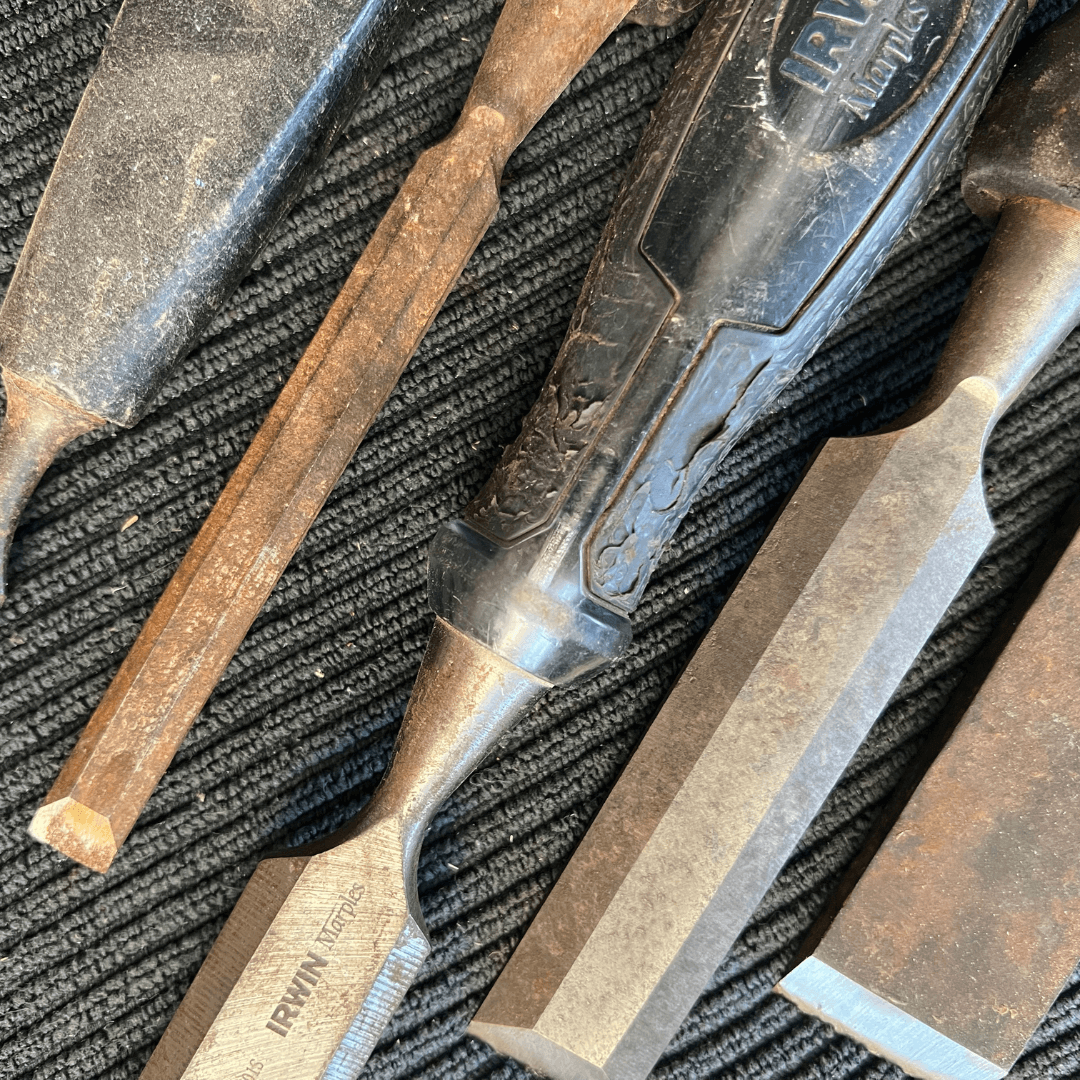 Set of chisels on a textured surface